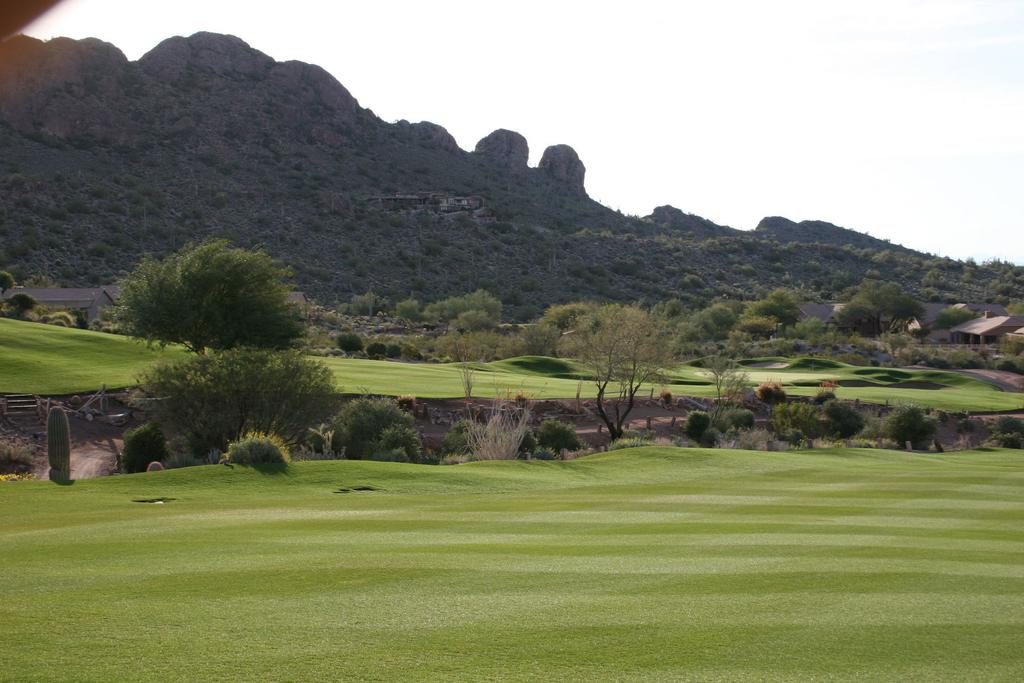 The hillside between golf course fairway and the large