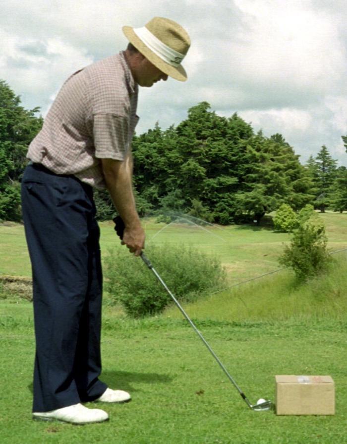 To do this drill place a ball on a tee and then position a cardboard box about an inch away from where the toe of your club will be (see the picture below).