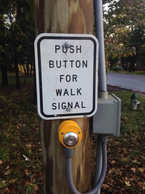 says it will activate a walk signal but there are not any pedestrian signals at this