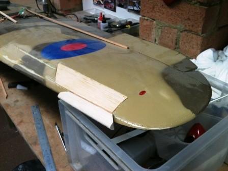 While the epoxy was drying I attacked the top surface of the port wing first by adding strip to the