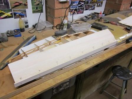 The top front sheeting is pinned and glued to the 1/4 balsa LE, the top of the
