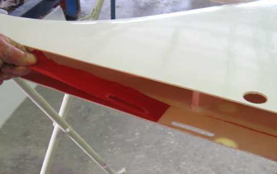 Prepare the vertical fin Start by laying the vertical fin on its side and drilling out the marked inspection hole on the left-hand side with a hole saw.