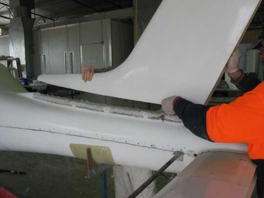 Pack the main wheels as required to level the aircraft. Fit the vertical fin You will need a second person to help you position and fit the vertical fin.