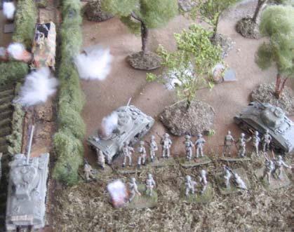 Left: The FO surveys the valley from his OP tank. A Company, 9th Durham Light Infantry, leaves its start line and advances towards the woods.