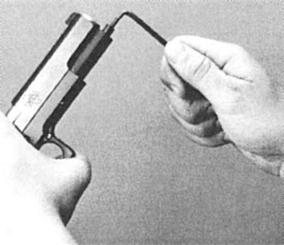 HANDGUN MAINTENANCE - DISASSEMBLY Two Piece Guide Rod Removal 1. Insert 5/32 Hex wrench into the hex head of Outer Guide Rod below the muzzle. Loosen the Guide Rod by turning counterclockwise. 2.