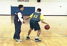 Athlete starts dribbling in place. 3. Coach takes the unprotected ball to show what we do NOT want to happen. 4.