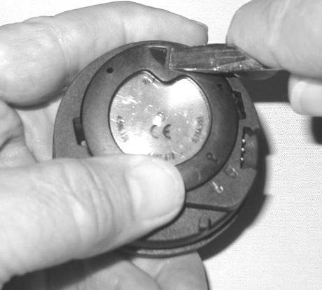 Fig. 95 -Engaging Retaining Ring Using your fingers, turn the Ring counter clockwise 5 degrees until the tabs engage (Fig.