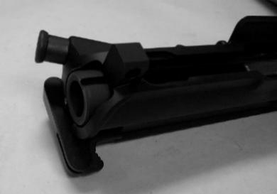 Reinsert the charging handle into the upper receiver by aligning the ears of the charging handle with the notch in the upper receiver, refer to