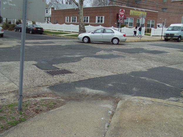 Transportation Concerns: Figure 9. 6th and Grape Street-Incorrect Ramp Crossing at 6th and Grape Street is non-conducive to individuals with special physical needs and bicycles.