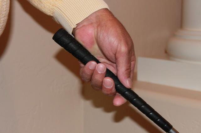 As club shaft is lowered to horizontal position, the grip will