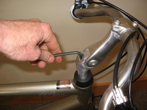 head tube. Cables should be in brackets and routed in smooth rounded paths (not pinched or bent). Insert stem into head tube (1-C).