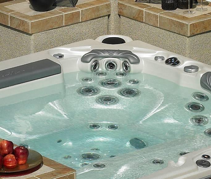 Enjoy movies in the rejuvenating waters of a Cal Spas hot tub. Beautify the spa environment with spa wraps from Cal Designs.