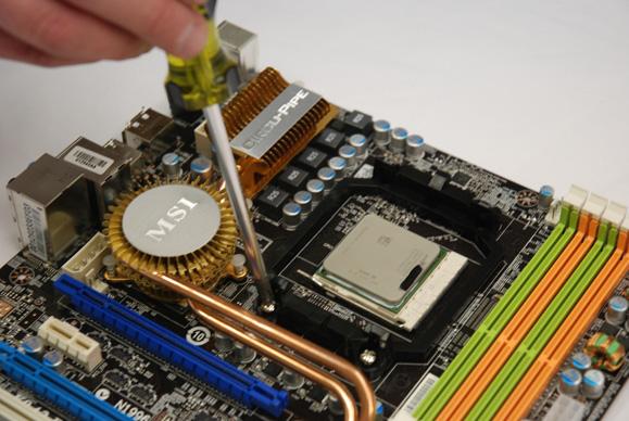 Then remove heat sink retention bracket from motherboard by unscrewing the four Philips head screws (Fig 6).
