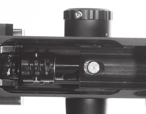 When the bolt is out of the rails, push the bolt to the rear of the rifle and continue to rotate the bolt until it comes out of the receiver (Figure 32)