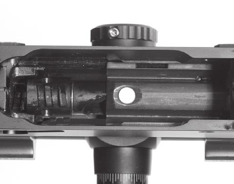 Carefully rotate the back of the bolt to the top of the receiver until is in place on the receiver guide rails (Figure 36).