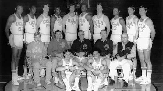 Middle Row: Manager George Morgan, assistant coach Gary Cunningham, head coach John Wooden, assistant coach Denny Crum and athletic trainer Ducky Drake.