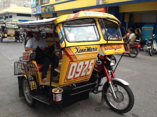 Motorized Tricycle : a vehicle similar to bicycle, but having three wheels, two at the back and one at the front vehicle recommendable waving convenient cheaper Cebu City is the second biggest city