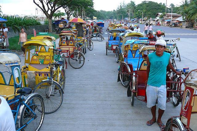 Pedal Pedicab (Trisikad) : a peculiar three- wheeled human powered vehicle The word sikad means kick or pedal, so it's unclear if its meaning comes from pedaling the bicycle or when the driver kicks