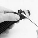 Place a small screwdriver under the clamp and twist it to pry the clamp off. 4. Unscrew and remove the retaining nut.