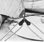 Raise the sail by pulling on the jib halyard line and at the same time advance the zipper down the luff until the jib tack is even with the roller furling housing. 4.