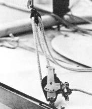 Thread the tensioner down through the tack shackle, then back up through the block on the jib halyard. Secure the line in the jam cleat on the sail. See Figure 39. 6. IMPORTANT.