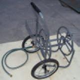 then wind garden hose around hose reel drum.