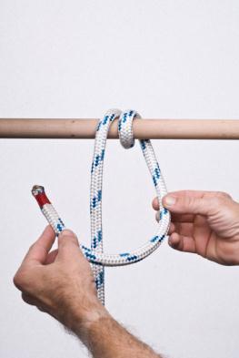 attach a rope to a ring or pole.
