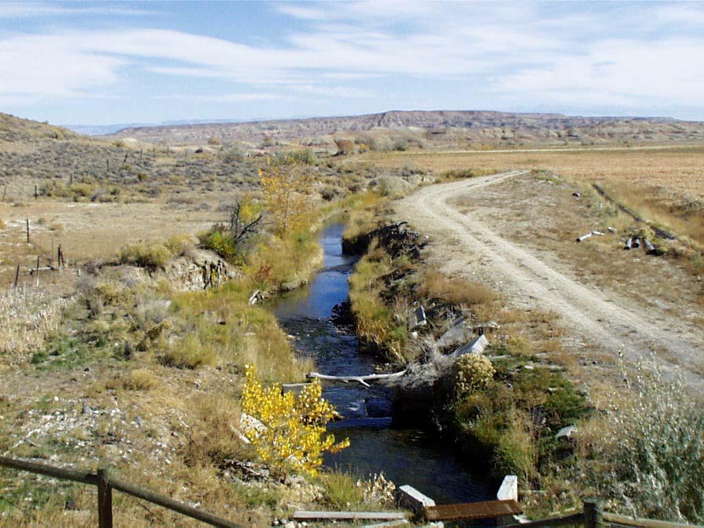 Photo 17 Beck-Allen Canal at State Hwy 30 crossing south of Burlington, Wyoming. Still actively irrigating at the time of photo. Big Horn River Basin.