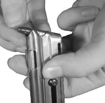 Loading the rifle Slide the manual safety forward to the safe position. Press the magazine catch and remove the empty magazine (fig. 4).