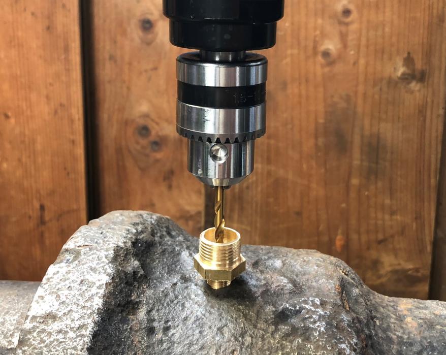 Step ten: Complete drilling through the injection body Using the 4mm drill bit (without the depth collar), drill through the centre of the injection body until the bit makes contact with the spigot.
