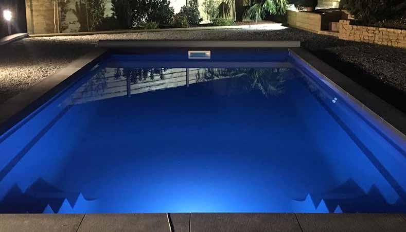 This modern rectangular pool offers beautiful square edged steps that lead into an enormous unobstructed area for swimming and playing.