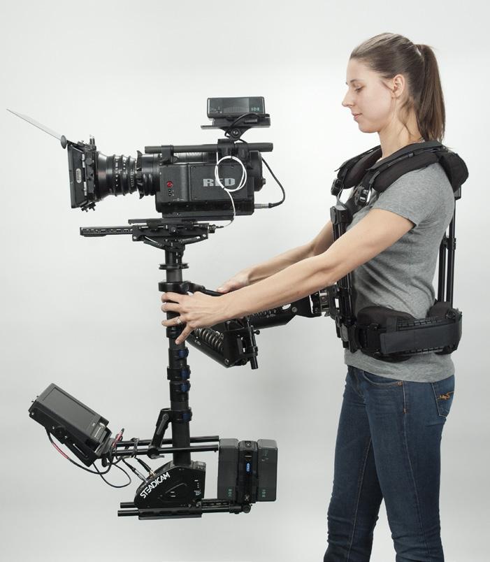 When you lift the Steadicam, the bulk of the weight should go into your pelvis, but allow a little stabilizing weight to rest on your shoulders don t leave a gap up there.