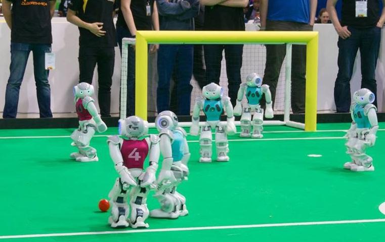 any teammates it may encounter while working on a shared task, in this case winning robot soccer games.