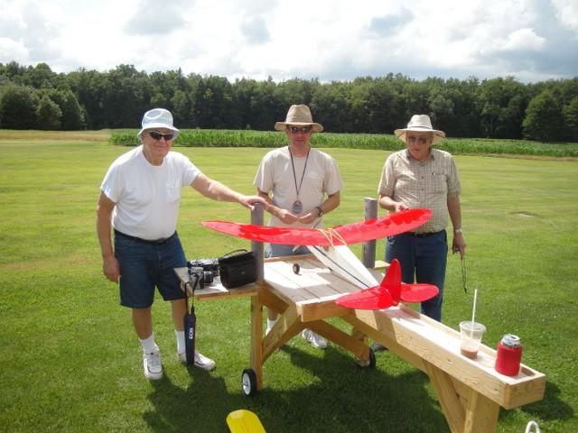 quick trip back to the house for repairs. Saturday, August 2 n d Club Member Caleb Butler celebrated his 87 t h birthday, doing what he loves to do, fly model airplanes!