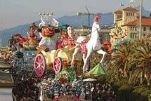 The Carnival of Viareggio is famous for the parade, made of papier mache, accompanied by costumed groups that