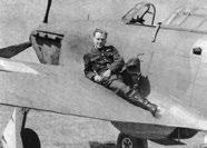 Above: Flight Lieutenant Ray Holmes, sitting atop his Hurricane P2725 TM-B. Top Right: P2725 TM-B s crash site on Buckingham Palace Road, 15 September 1940.