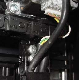 emove the screws that secure the harness chains below the X-axis motor assembly.