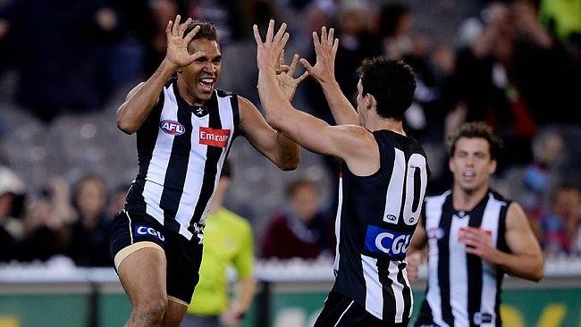 Andrew Krakouer celebrates a goal with Scott Pendlebury. Picture: Colleen Petch Source: Herald Sun "You just have to deal with that situation.