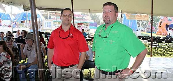 Williston City Councilman Matt Brooks (left) and Levy County Commission Chairman John Meeks visit with each other a bit before the start of the fair.