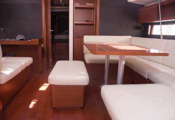 62 LEFT TO RIGHT: View forward from the aft port cabin. The galley is a safe enclosure. You can see the seat and nav station forward. Even in the low morning sun this is a light-filled saloon.