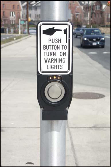 9 Figure 3. Example of pedestrian pushbutton and R10-25 sign with pilot light for pedestrian actuation.