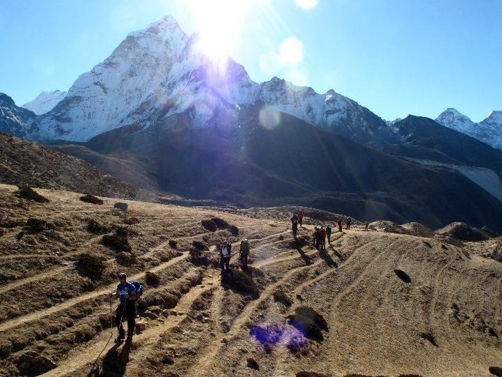 With the buzz of expedition in the air, we leave Lobuche at dawn. The sun soon reaches the summits of the Himalayan peaks and slowly lights up the valley floor.
