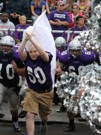 Honor Carrying the Chieftain flag onto the field is senior Jake Pannell.