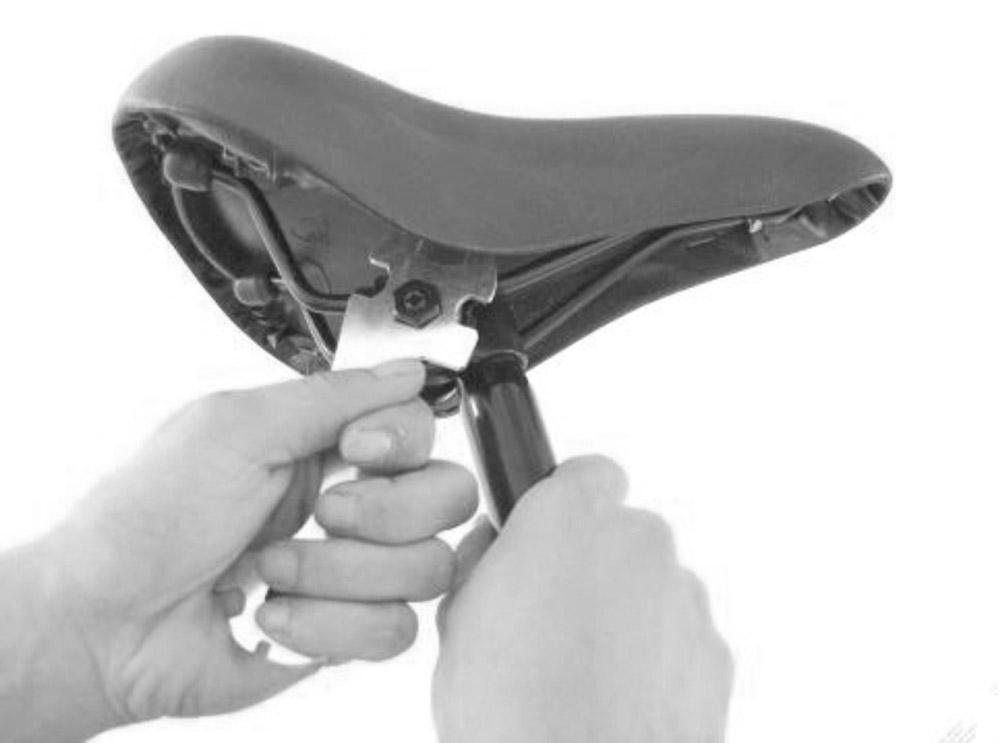 6 3. ATTACHING THE SADDLE Saddle Nut Spanner Seat Post If not already attached, firmly push the narrow end of the seat post into the hole on the underside of the saddle, and tighten