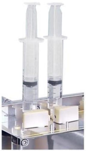 b) Empty any contents of the drive syringes into waste reservoir syringes by pushing the drive syringe piston upwards into reservoir syringes.