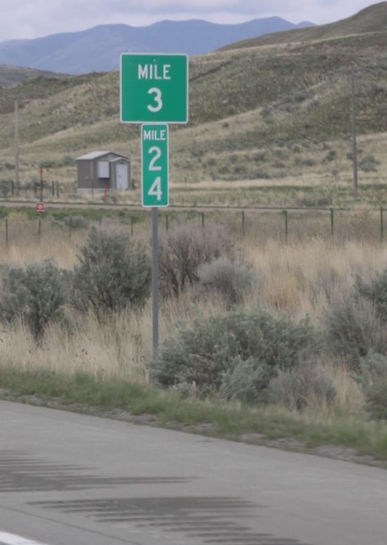 MILE MARKERS Usually green or white and have the word MILE along with a number - some just have the number Mile markers show the number of miles from where the Interstate route entered a state