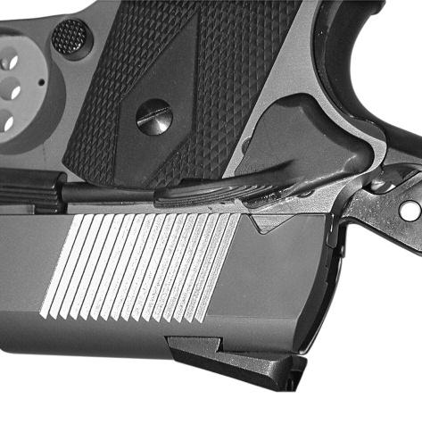 Point the muzzle in a safe direction and depress the magazine release and remove the magazine (FIGURE 4).