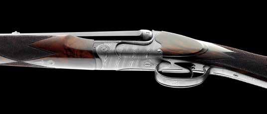Azur XA Side by side double rifle, ejector model with double triggers. Scalloped rounded action.