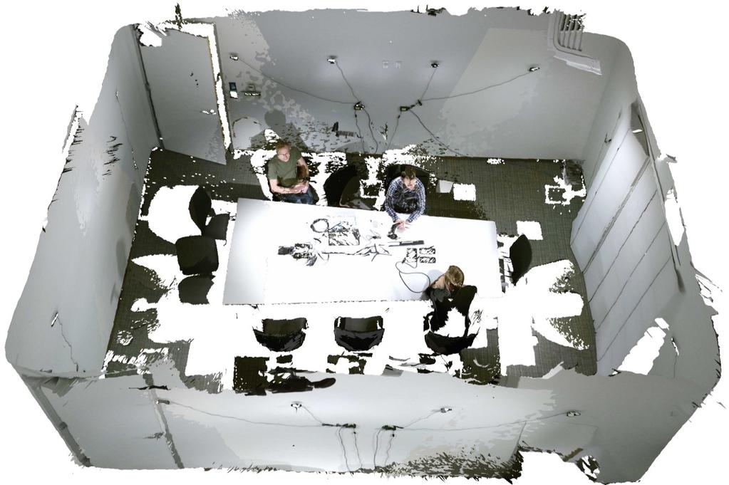Figure 4. Rendering of live depth and color data from eight Kinect v2 cameras mounted in the ceiling to cover a conference room.