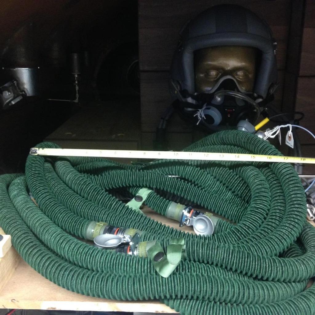 outlet and the CRU-60 mask oxygen connector. An additional length of about 4 feet existed between the regulator outlet and the breathing gas flow meter outlet.